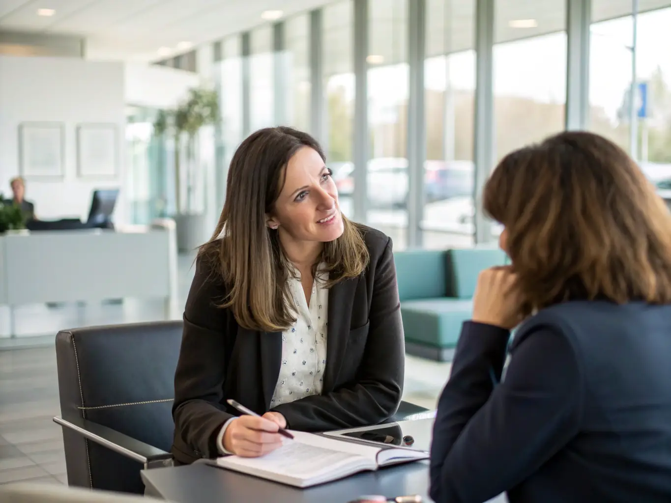 A professional insurance agent is speaking on the phone with a senior, discussing Medicare options in a bright and modern office setting. The focus is on building trust and providing clear information.