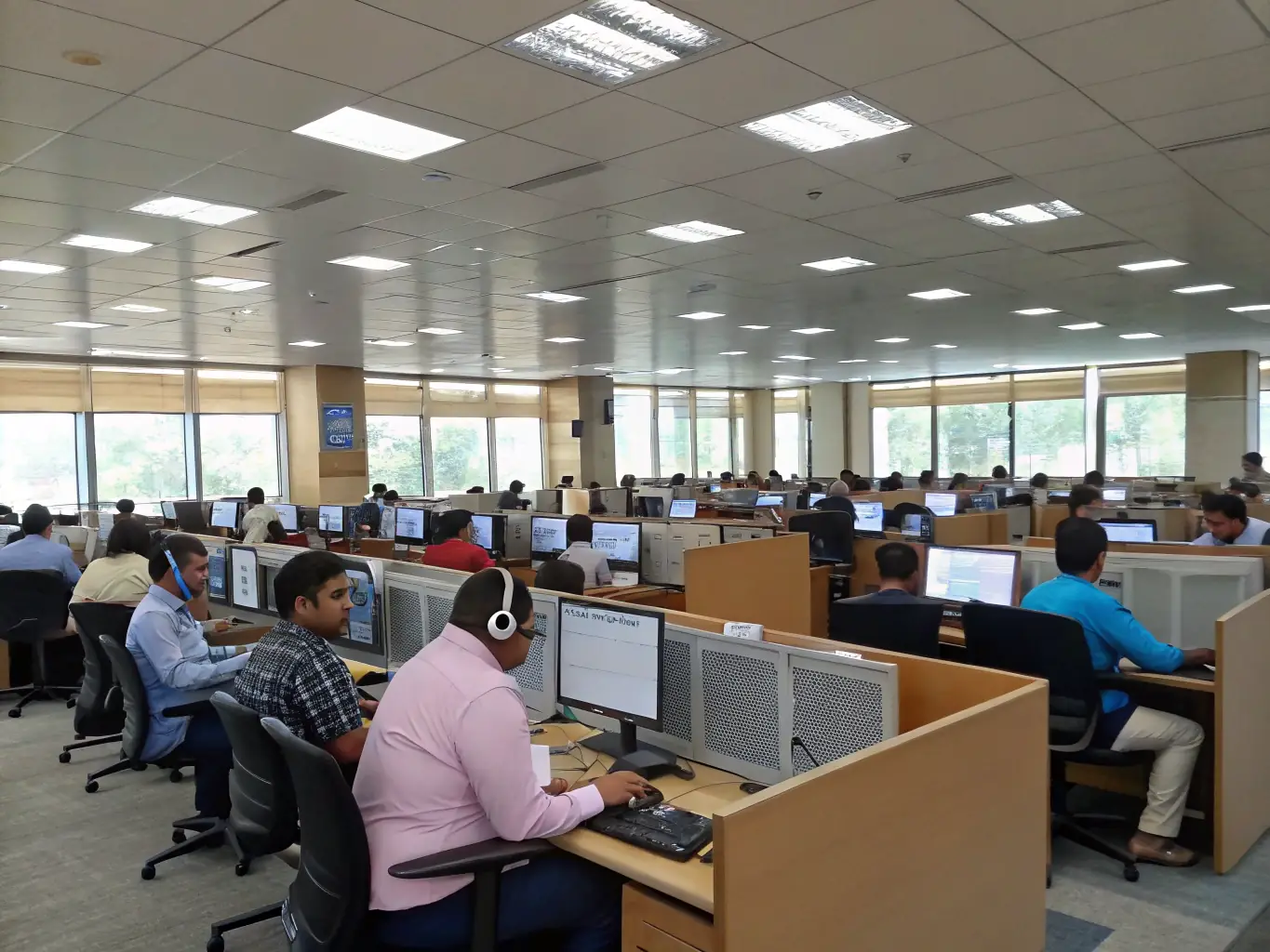 A diverse team of call brokers is efficiently managing inbound calls in a state-of-the-art call center, using advanced technology to connect seniors with insurance agents seamlessly.